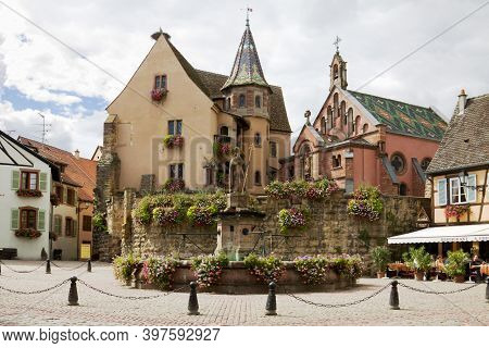 Eguisheim, France - September 10, 2010: The Castle, Church And Fountain Named Saint Leon On The Cent