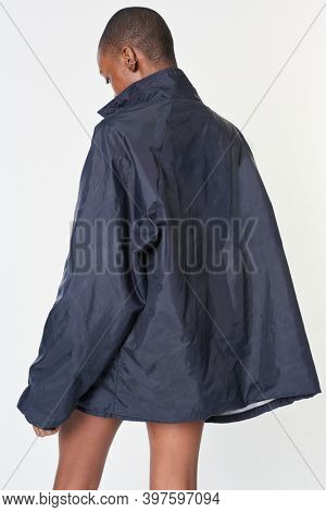 Black woman wearing a navy blue waterproof jacket mockup