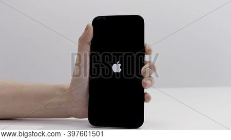Drezden, Germany - 11.28.2020: Close Up Of Female Hand Activating New Beautiful Apple Smartphone Iso