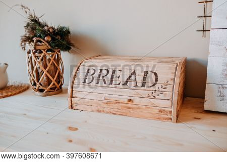 Christmas Decorations. Bascet With Fir Branches And Breadbox On The Wooden Table. Festive Table Deco