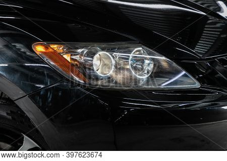 Novosibirsk, Russia - November 26, 2020: Mazda Cx7, View Of The Front  Of The Car. Black Car Headlig