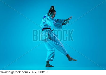 Active Training. Professional Female Judoist In White Judo Kimono Practicing And Training Isolated O