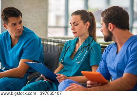 Three Doctors Having An Changeover And Feeling Good