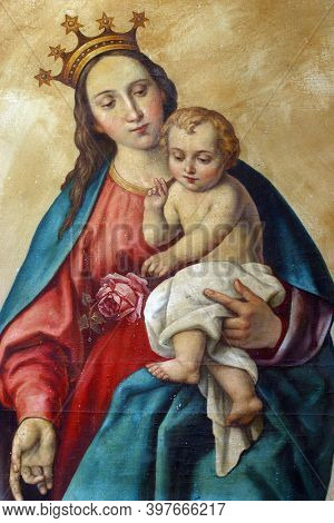 LUN, CROATIA - AUGUST 17, 2013: Virgin Mary with baby Jesus altarpiece at St. Jerome parish church in Lun, Croatia