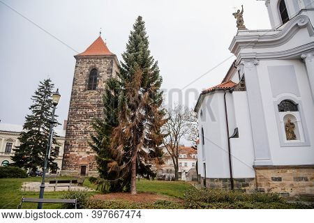 Gothic Medieval Stone Bell Tower And Baroque Saint Gothard Church In Old Historic Center Of Cesky Br