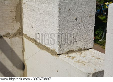 A Close-up Of A Corner Of A Masonry Wall Made From Autoclaved Aerated Concrete Blocks (aac) With A S