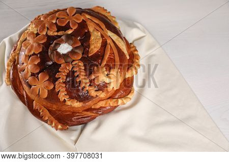 Korovai On White Table, Above View. Ukrainian Bread And Salt Welcoming Tradition