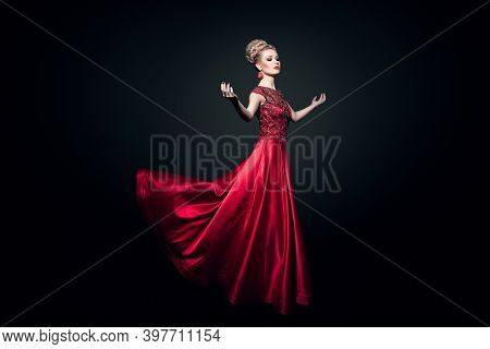 Fulll Length View Of A Wonderful Young Woman Dressd In A Long Fluing Red Dress With Raised Hands, Ov