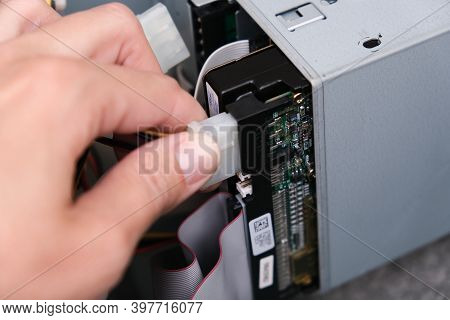 Moscow, Russia - September 08, 2020: Hands Of A Technician Pluging The Cable While Computer Rapair A