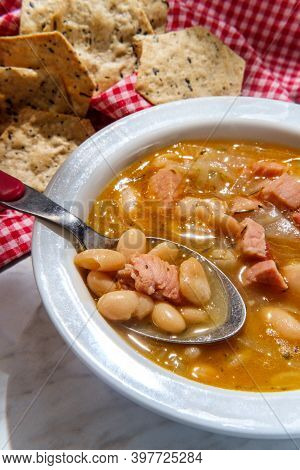 Simple Slow-cooker Ham And Cannellini Bean Soup With Multigrain Hexagon Crackers For Dipping