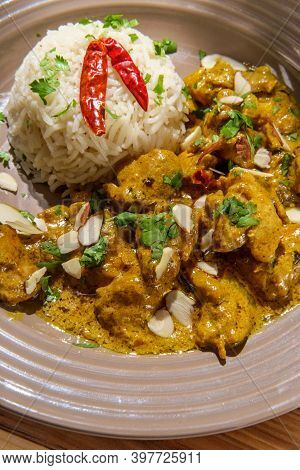 Indian Chicken Korma Curry Dinner With Basmati Rice And Almonds