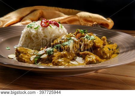 Indian Chicken Korma Curry Dinner With Basmati Rice And Almonds