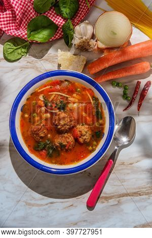 Loaded Italian Tomato Meatball Soup With Cannellini Beans Spinach Green Peas And Parmesean Rind