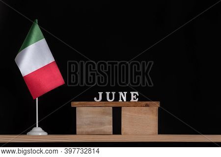 Wooden Calendar Of June With Italian Flag On Black Background. Dates In Italy In June.