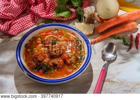 Loaded Italian Tomato Meatball Soup With Cannellini Beans Spinach Green Peas And Parmesean Rind