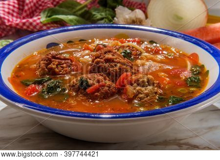 Loaded Italian Tomato Meatball Soup With Cannellini Beans Spinach Green Peas And Parmesean Rind
