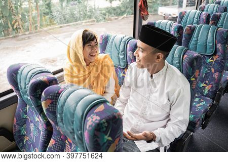 Muslim Couple Travel By Bus During Eid Mubarak Holiday