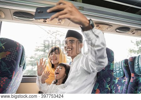 Muslim Holiday Trip Riding A Bus Together With Family
