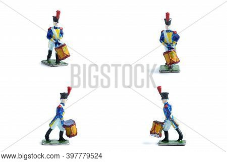 4 In 1 Shot Of Handmade Tin Soldiers With Drum On The White Background