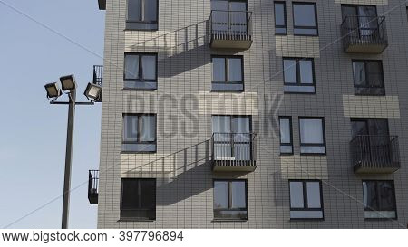 Bottom View Of Residential New Building Made Of White Bricks. Action. Fragment Of A White Brick New 