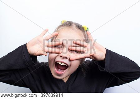 Funy And Happy Little Girl. Girl Close Eyes.