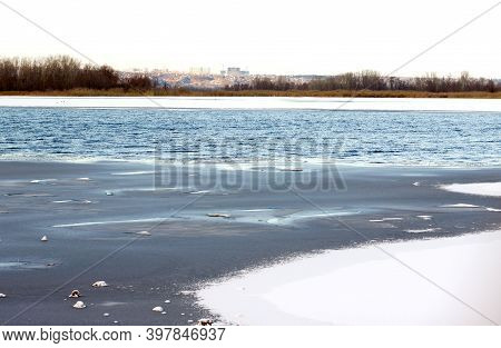 Ice-hole On The River Wormwood On The River Thin Ice Washes Away With Water And Holes Form In The Ic