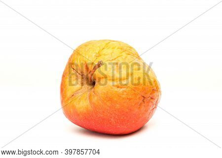 A Picture Of An Ordinary Apple, Without Modifications The Apple Is Old, Dry An Not Attractive. It Is