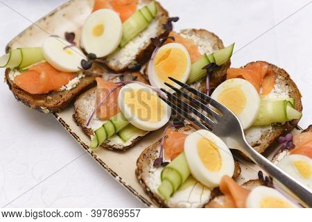 Bruschetta With Cheese, Cucumber, Salmon And Boiled Egg On A Plate, Sandwiches