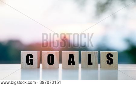 The Word Goals On A Wooden Cube, The Concept Of Setting Goals For Success.