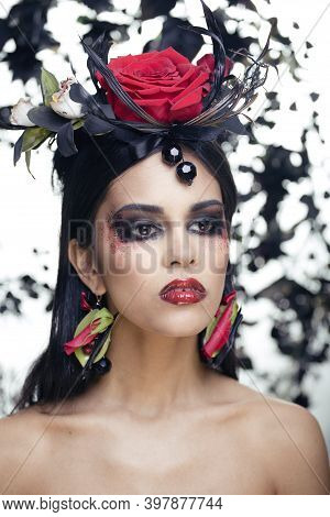 Pretty Brunette Woman With Rose Jewelry, Black And Red, Bright Make Up Kike A Vampire Closeup Red Li