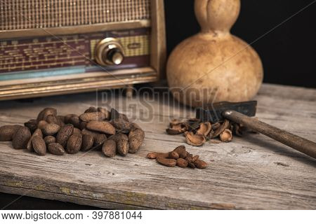 Rustic Table To Split Almonds With Old Radio