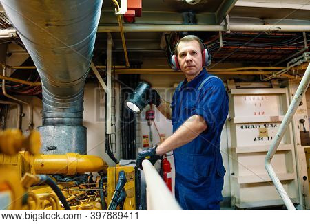 Marine Engineer Officer Controlling Vessel Enginesand Propulsion In Engine Control Room Ecr