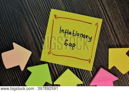 Inflationary Gap Write On Sticky Notes Isolated On Wooden Table. Finance Concepts