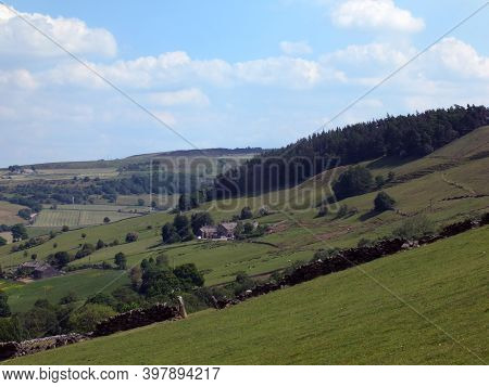 Panoramic View Across The Calder Valley Near Mytholmroyd In West Yorkshire With A Pine Tree Plantati