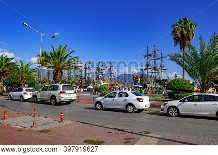 Turkey, Alanya - October 22,2020: Street View Of Cars On The Road And Vintage Ships In The Port On E