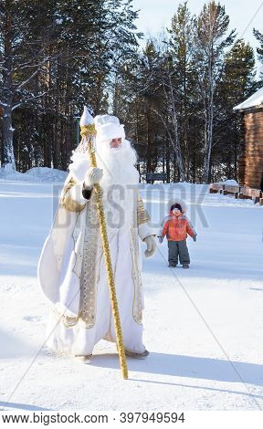 Irkutsk, Russia- 8 January 2019: Father Frost Wolking In The Park Of Ethnographic Museum Taltci.