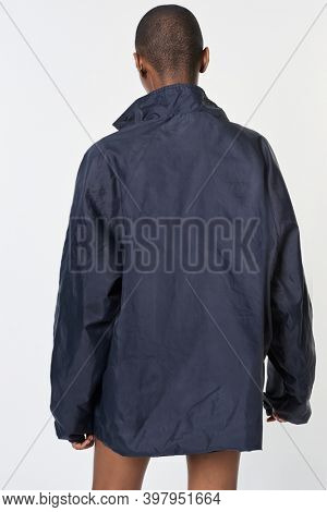 Black woman wearing a navy blue waterproof jacket mockup