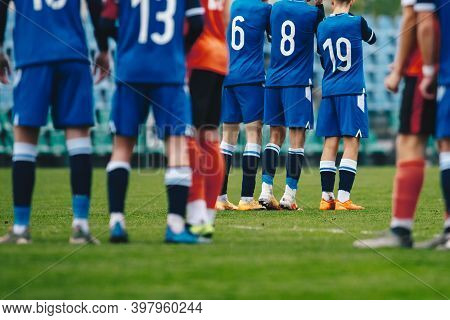 Football Players Standing In A Wall During Free Kick. Soccer League Match Of Youth Teams