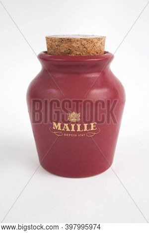 A Pot Of Maille French Mustard Against A White Studio Background