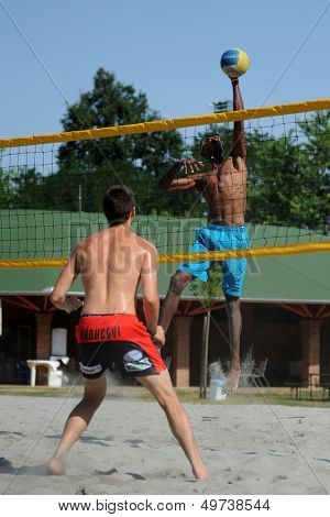 KAPOSVAR, HUNGARY - AUGUST 4: Leonel Munder (R) in action at a ROAK Viragfurdo Kupa beach volleyball competition, August 4, 2013 in Kaposvar, Hungary.