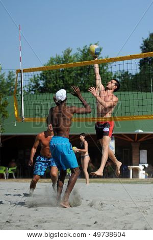 KAPOSVAR, HUNGARY - AUGUST 4: Leonel Munder (L) in action at a ROAK Viragfurdo Kupa beach volleyball competition, August 4, 2013 in Kaposvar, Hungary.