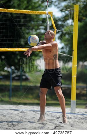 KAPOSVAR, HUNGARY - AUGUST 4: Balint Magyar in action at a ROAK Viragfurdo Kupa beach volleyball competition, August 4, 2013 in Kaposvar, Hungary.