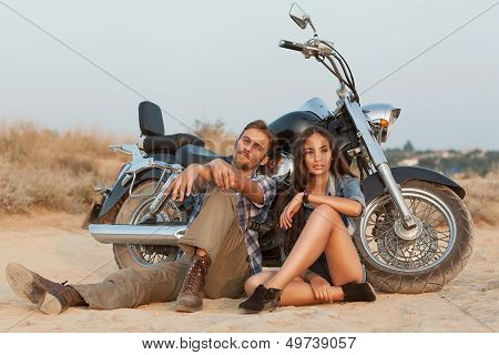 Happy Young Love Couple On Scooter Enjoying Themselves On Trip