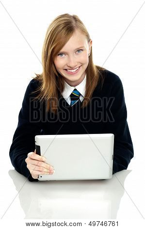 Pretty Schoolgirl Holding Newly Launched Tablet Pc