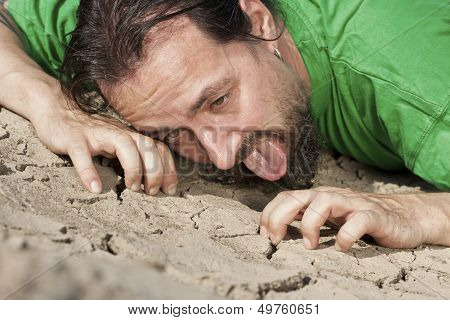 Thirsty Man On Parched Soil