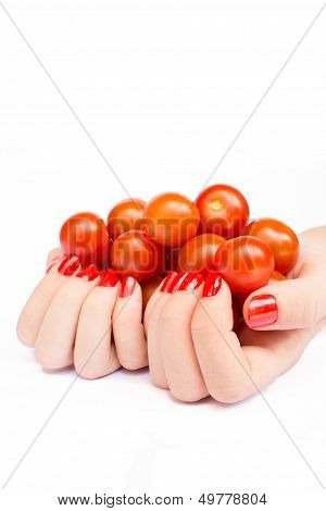 Two hands holding cherry tomatoes