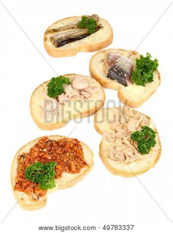 Tasty sandwiches with tuna and cod liver sardines different kinds of canned fish, isolated on white