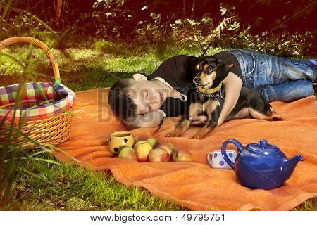 Boy Sleeping On Blanket With His Dog