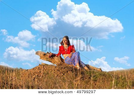 Young  Hippie Siting On The Hillock