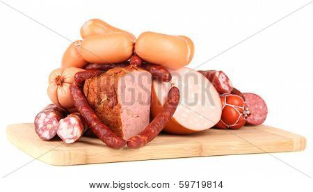 Lot of different sausages on wooden board isolated on white